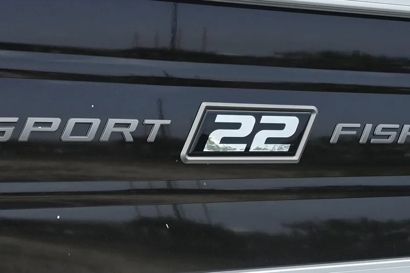 Slide: The Image of 2026 Sun Tracker SportFish 22 XP3 logo on black surface. - 5
