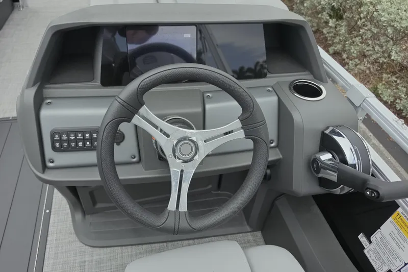 Slide: The Image of Steering console of 2026 Sun Tracker SportFish 22 XP3 boat with modern controls. - 6