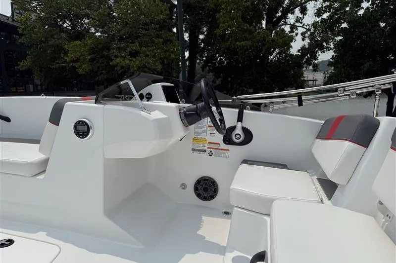 Slide: The Image of 2026 Tahoe T18 boat interior with steering wheel and seating, featuring modern design elements. - 7