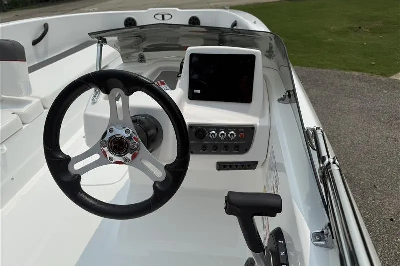 Slide: The Image of Steering console of 2026 Tahoe T18 boat with modern controls and display. - 6