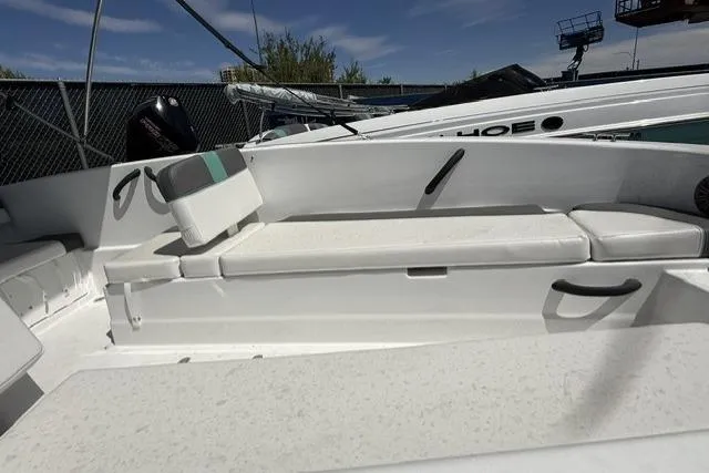 Slide: The Image of 2026 Tahoe T18 boat interior with white seating and modern design. - 9