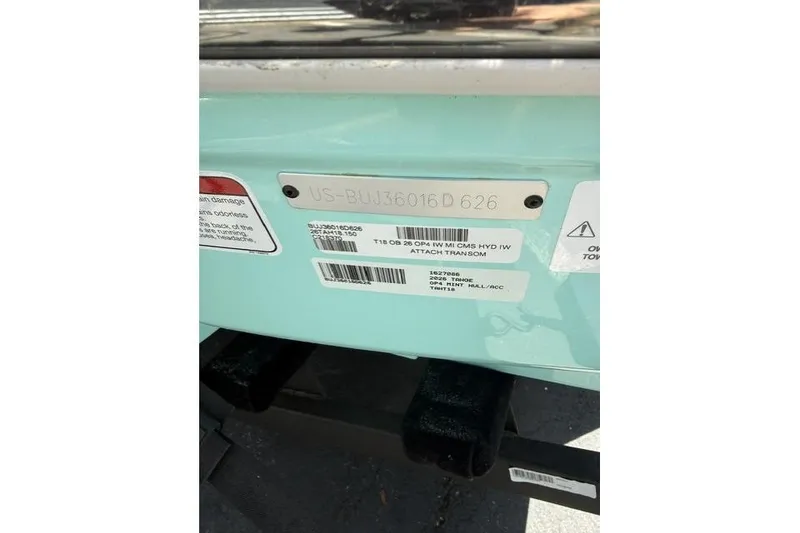 Slide: The Image of 2026 Tahoe T18 boat identification plate with serial numbers and warning labels. - 10