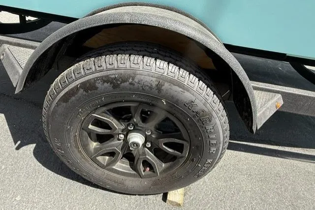 Slide: The Image of 2026 Tahoe T18 trailer wheel with black alloy rim and KARRIER tire. - 4