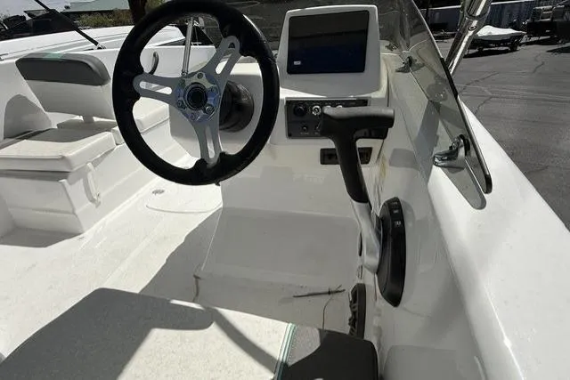 Slide: The Image of 2026 Tahoe T18 boat cockpit with steering wheel and control panel. - 5