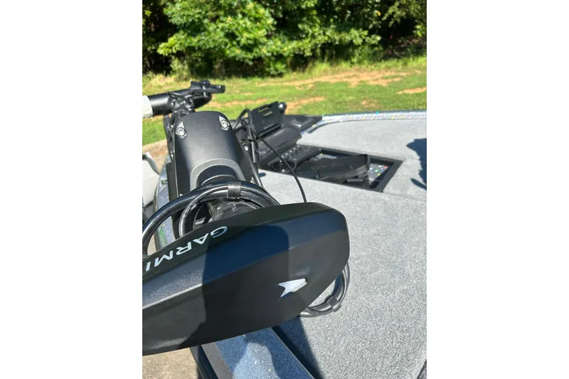 Slide: The Image of 2026 Nitro Z19 XL Pro boat with Garmin equipment on deck, surrounded by greenery. - 2