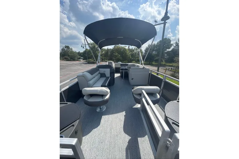 Slide: The Image of 2026 Sun Tracker Fishin' Barge 20 DLX pontoon boat with spacious seating and canopy. - 4