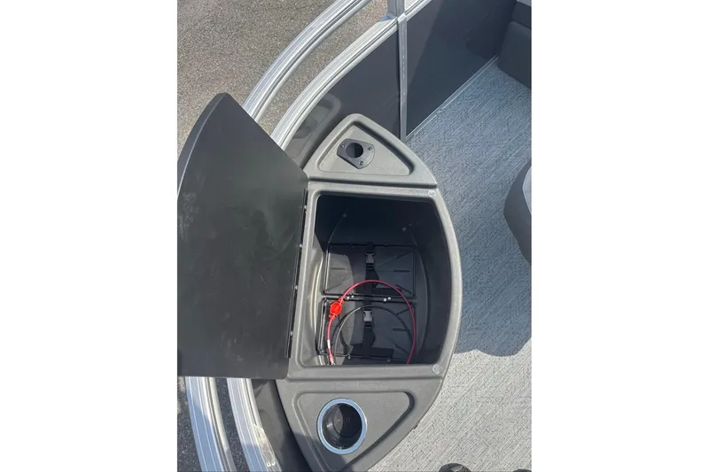 Slide: The Image of Open storage compartment on 2026 Sun Tracker Fishin' Barge 20 DLX boat deck. - 5
