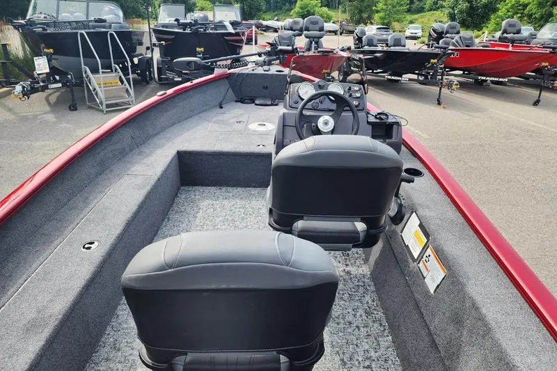Slide: The Image of 2026 Tracker Super Guide V-16 SC boat interior with dual seats and steering console. - 3