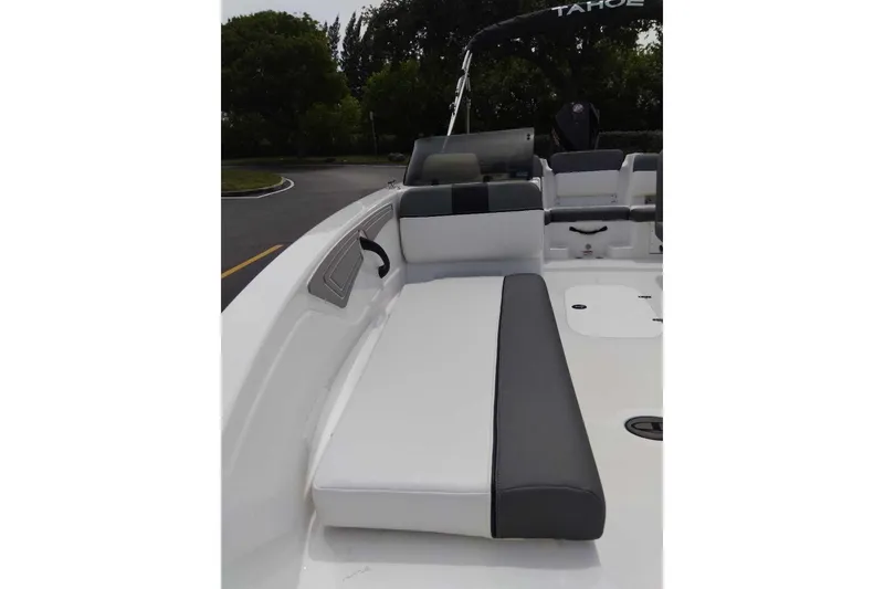 Slide: The Image of 2026 Tahoe T21 boat interior with cushioned seating and sleek design. - 9