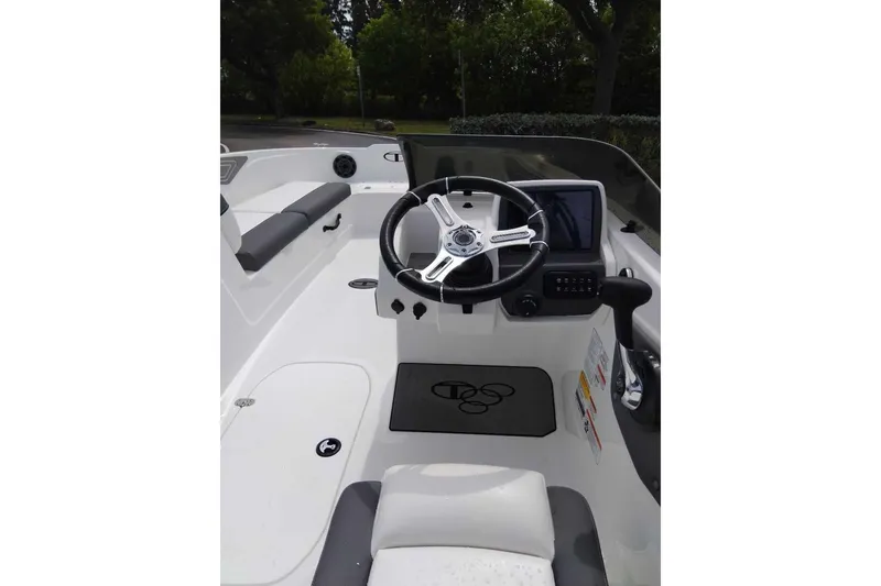 Slide: The Image of 2026 Tahoe T21 boat interior with steering wheel and dashboard controls. - 6