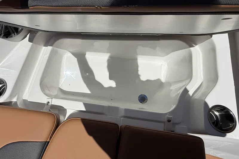 Slide: The Image of 2026 Tahoe 1950 boat interior with storage compartment and seating. - 19