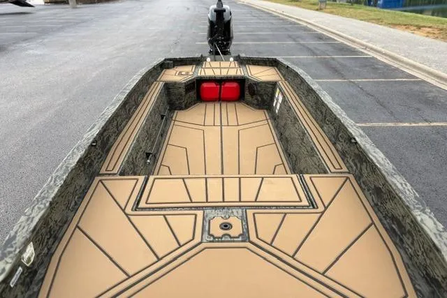 Slide: The Image of 2026 Tracker Grizzly 1650 T Prairie Wings Edition boat interior with camouflage design and spacious layout. - 14