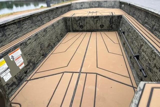 Slide: The Image of 2026 Tracker Grizzly 1650 T Prairie Wings Edition boat interior with camouflage design. - 15