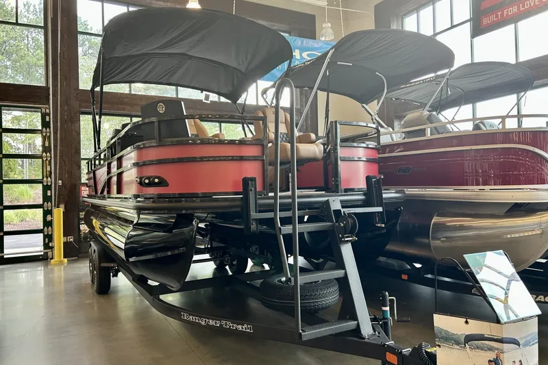 Slide: The Image of 2026 Ranger 220F pontoon boat with canopy on display in showroom. - 4