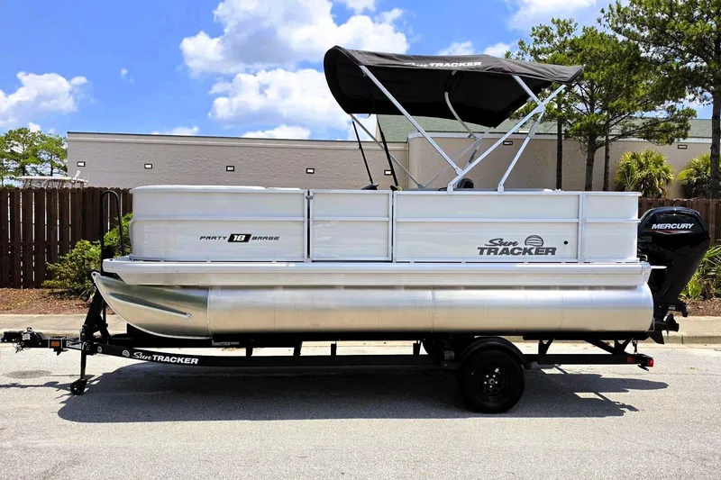 Slide: The Image of 2026 Sun Tracker Party Barge 18 DLX pontoon boat with canopy and Mercury outboard motor. - 6
