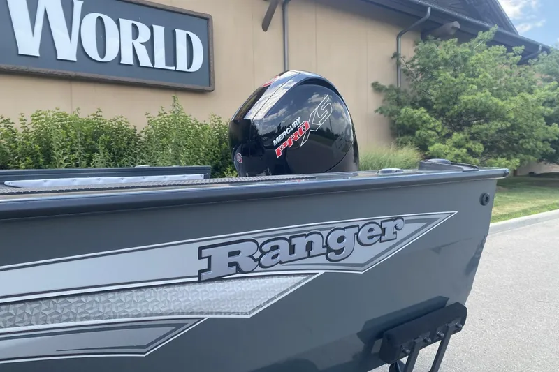 Slide: The Image of 2026 Ranger VX1788 WT boat with Mercury Pro XS engine, outdoors near greenery. - 2