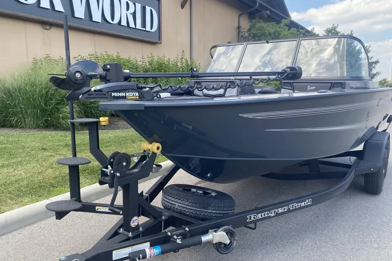 Slide: The Image of 2026 Ranger VX1788 WT boat on trailer, parked outdoors near a building. - 3