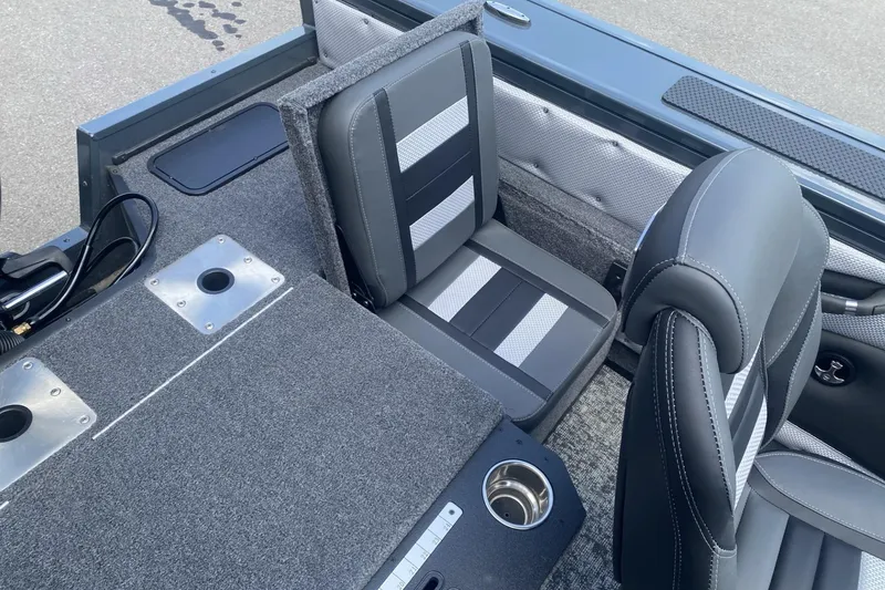 Slide: The Image of 2026 Ranger VX1788 WT boat interior with gray seating and carpeted flooring. - 6