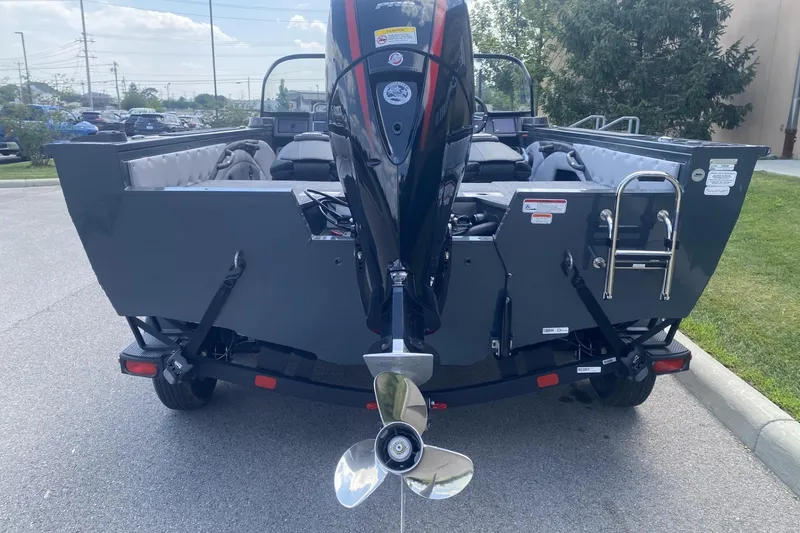 Slide: The Image of 2026 Ranger VX1788 WT boat rear view with outboard motor and ladder. - 4