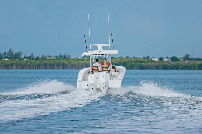 Slide: The Image of 2026 Jupiter 32 boat cruising on open water with passengers onboard. - 13