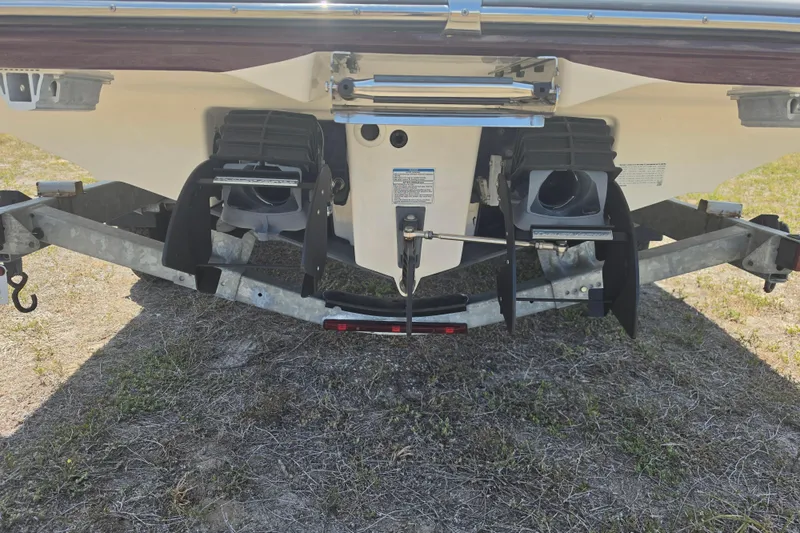 Slide: The Image of Rear view of 2022 Yamaha Boats 252SD on trailer, showcasing dual jet propulsion system. - 5