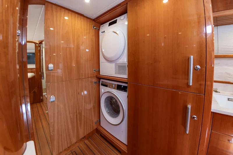 Slide: The Image of Washer and dryer in a wooden cabin on a boat. - 39
