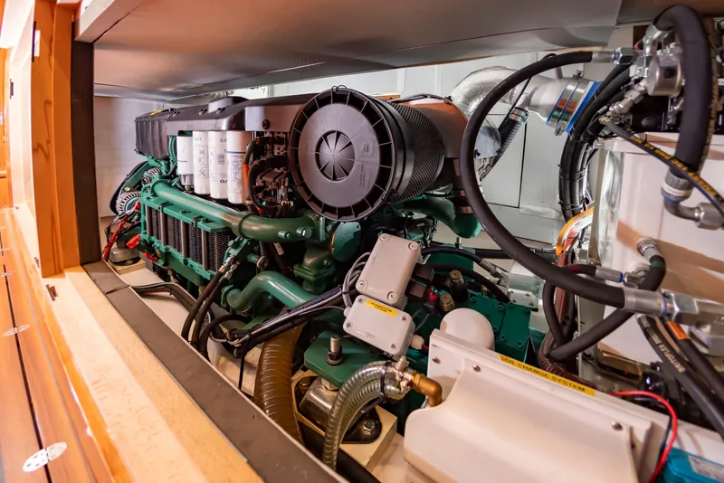 Slide: The Image of The engine room of a 2020 Elling E6 boat features a powerful engine with complex wiring. - 35