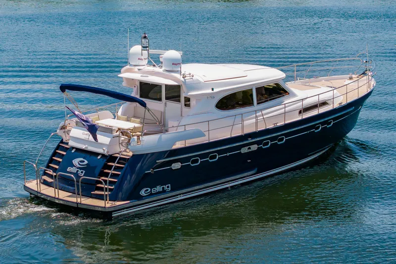 Slide: The Image of Elling E6 2020 on calm water with sleek design and spacious deck. - 5