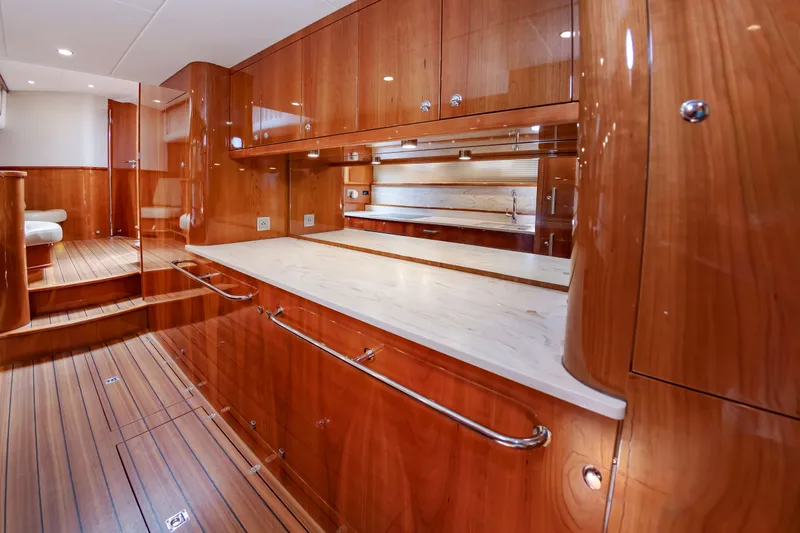 Slide: The Image of Luxurious wood paneling in the kitchen of a 2020 Elling E6 yacht. - 32