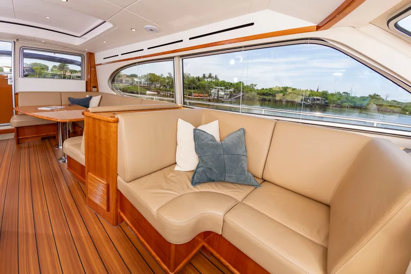 Slide: The Image of Interior of an Elling E6 yacht with leather sofa and wooden floor, view of the water. - 20