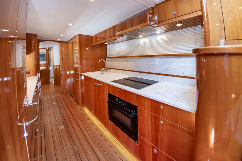 Slide: The Image of Luxurious kitchen with wood paneling and modern appliances on a yacht. - 30