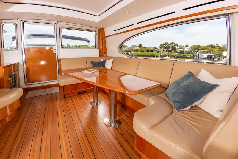 Slide: The Image of Interior of an Elling E6 yacht with elegant wood flooring and comfortable seating. - 18