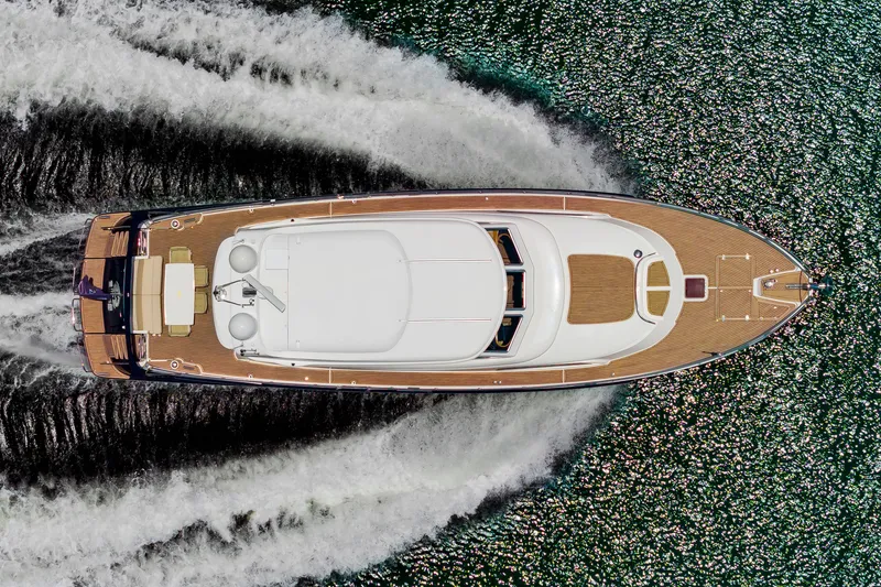 Slide: The Image of Aerial view of a 2020 Elling E6 yacht speeding across the water. - 1