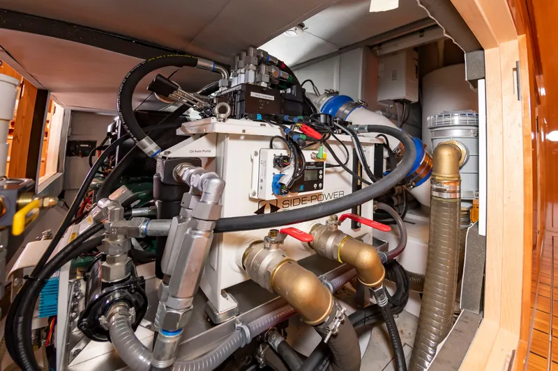 Slide: The Image of Engine room with complex piping and hydraulic systems. - 34