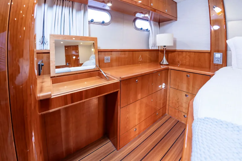 Slide: The Image of Interior of a luxurious cabin with wooden furnishings and a small mirror. - 41