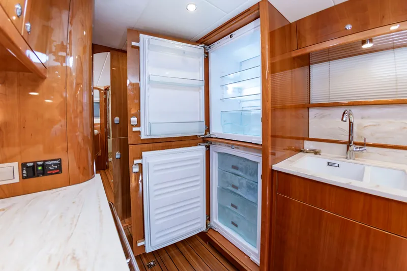 Slide: The Image of Interior of an Elling E6 yacht with open fridge-freezer and sink. - 38