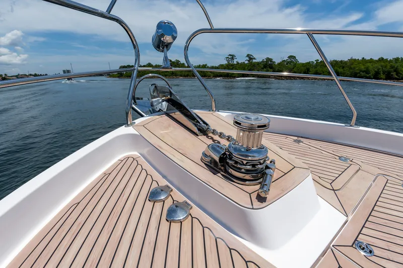 Slide: The Image of The foredeck of a 2020 Elling E6 with anchor winch and wooden planks. - 9