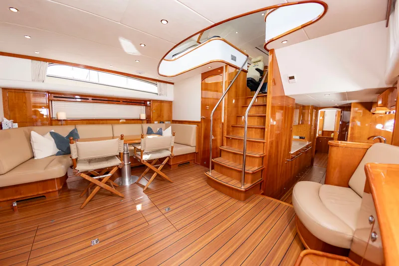 Slide: The Image of Interior of the Elling E6 yacht with elegant wood flooring and comfortable seating. - 26