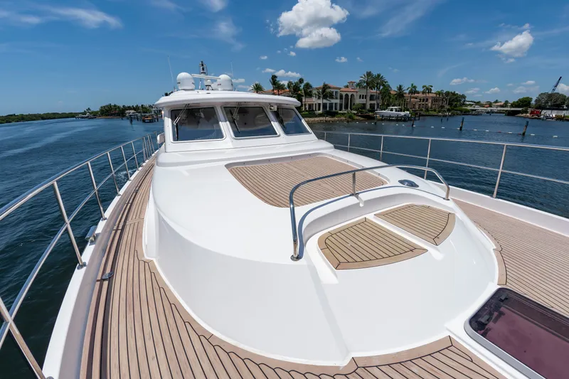Slide: The Image of Elling E6 yacht from 2020 on calm water with a luxurious deck. - 8