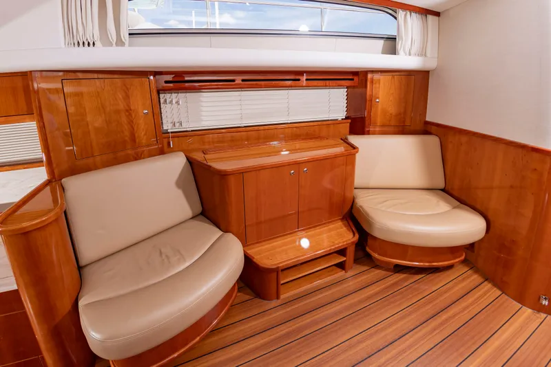 Slide: The Image of Interior of the Elling E6 yacht with elegant wood furnishings and comfortable seating. - 28