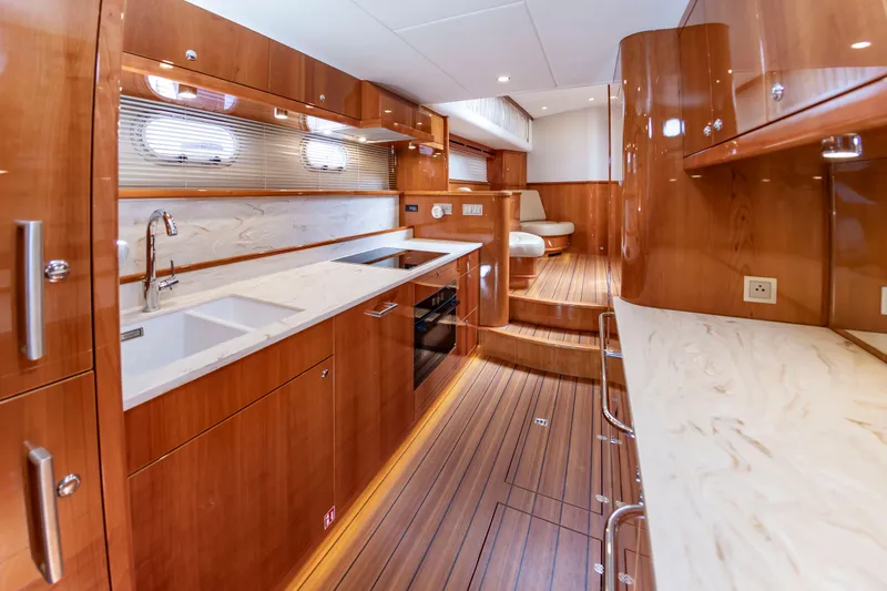 Slide: The Image of Luxurious kitchen on a 2020 Elling E6 yacht with wood paneling and modern appliances. - 37
