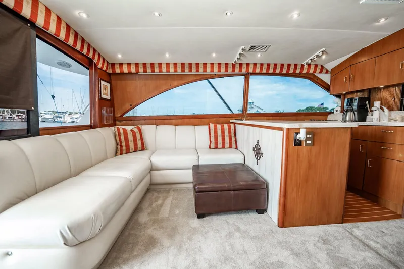 Slide: The Image of Luxurious interior of 2000 Ocean Yachts 43 Super Sport with plush seating and elegant wood finishes. - 17