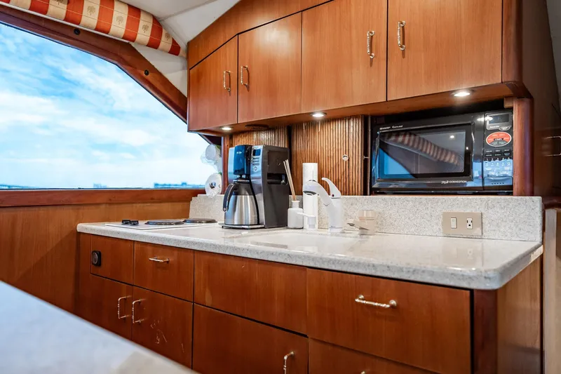 Slide: The Image of Luxurious kitchen interior of 2000 Ocean Yachts 43 Super Sport with modern appliances. - 18