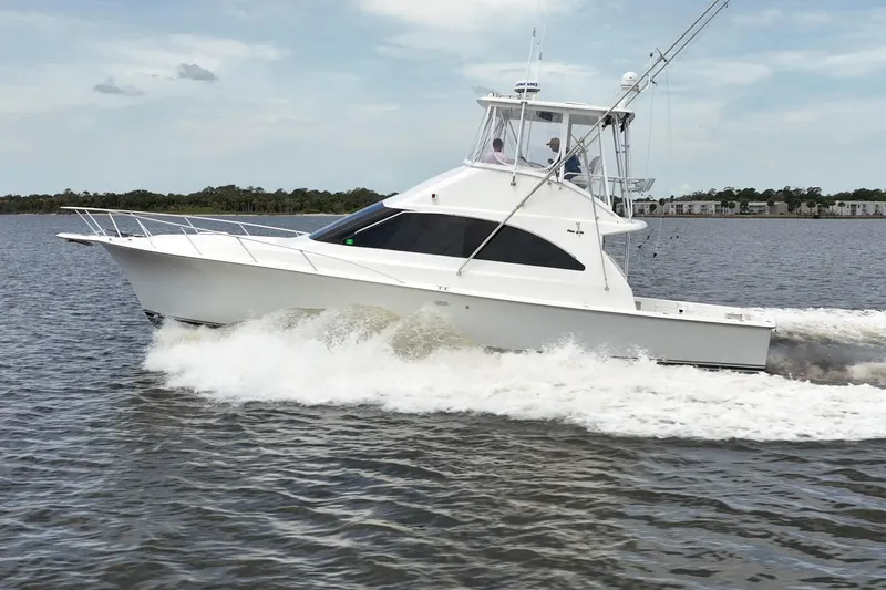 Slide: The Image of 2000 Ocean Yachts 43 Super Sport cruising on open water. - 2