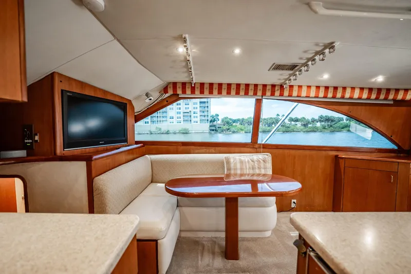 Slide: The Image of Luxurious interior of 2000 Ocean Yachts 43 Super Sport with dining area and scenic window view. - 21