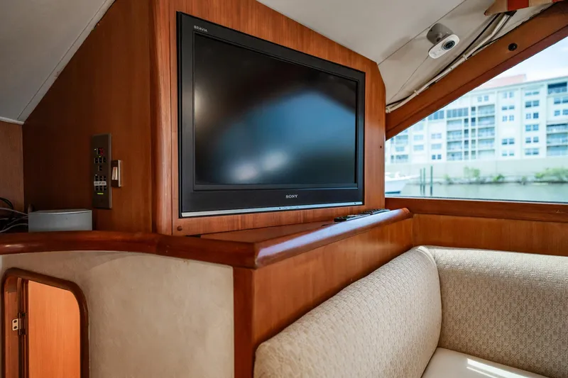 Slide: The Image of Interior of 2000 Ocean Yachts 43 Super Sport with TV and seating area. - 22