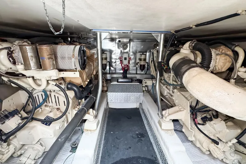 Slide: The Image of Engine room of 2000 Ocean Yachts 43 Super Sport, showcasing dual marine engines. - 32