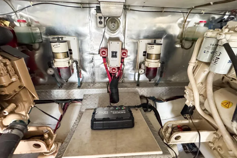 Slide: The Image of Engine room of a 2000 Ocean Yachts 43 Super Sport, showcasing mechanical components. - 33