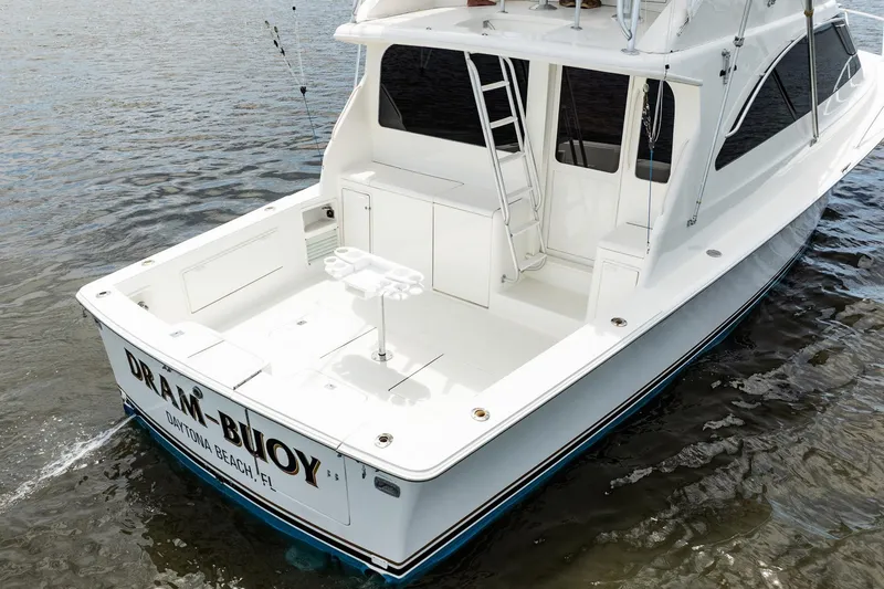 Slide: The Image of 2000 Ocean Yachts 43 Super Sport boat on water, rear view, white exterior. - 36