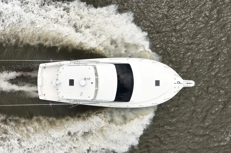 Slide: The Image of Aerial view of 2000 Ocean Yachts 43 Super Sport cruising on water. - 38